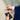 Photograph of a man in suit pulling out an american express card from the Avenger RFID Bifold Wallet